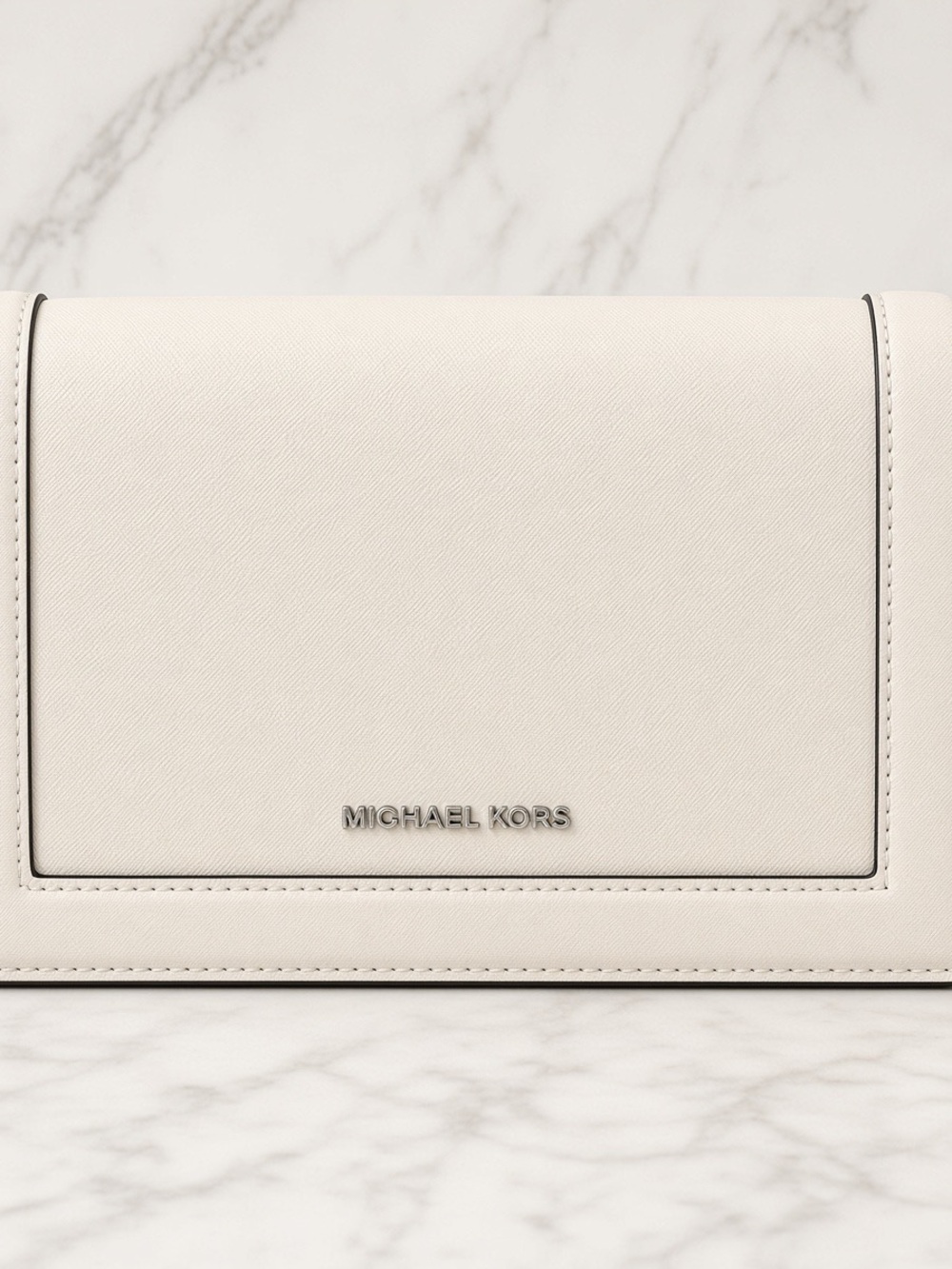 Michael Kors White Crossbody Bag with silver detail. From Jet Set Collection.